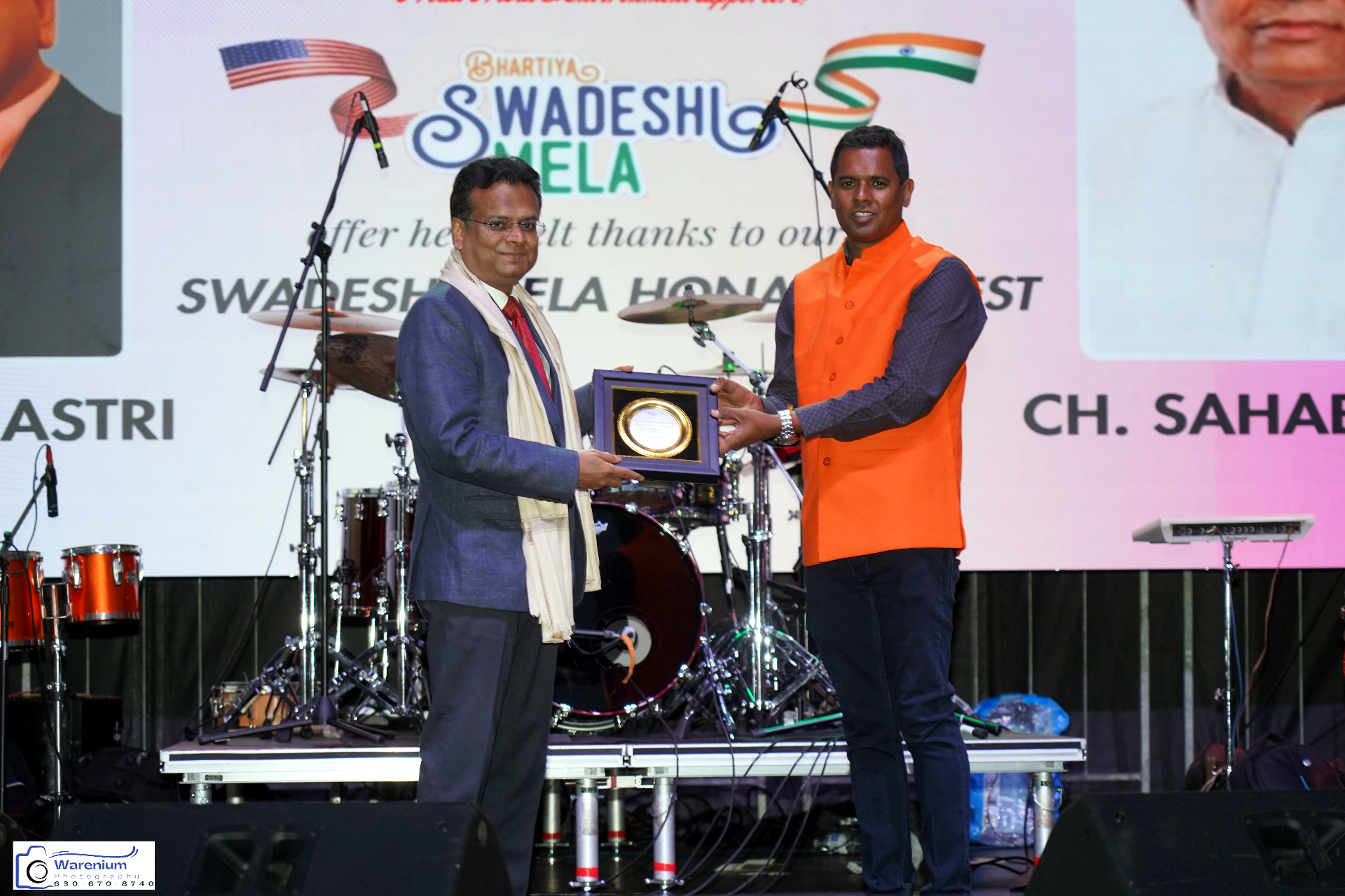 Swadeshi Mela honored guest receiving a memento on stage