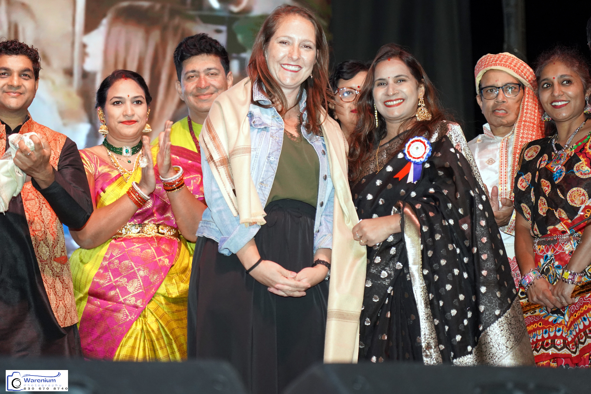 Community leaders and performers celebrating on stage at Swadeshi Mela